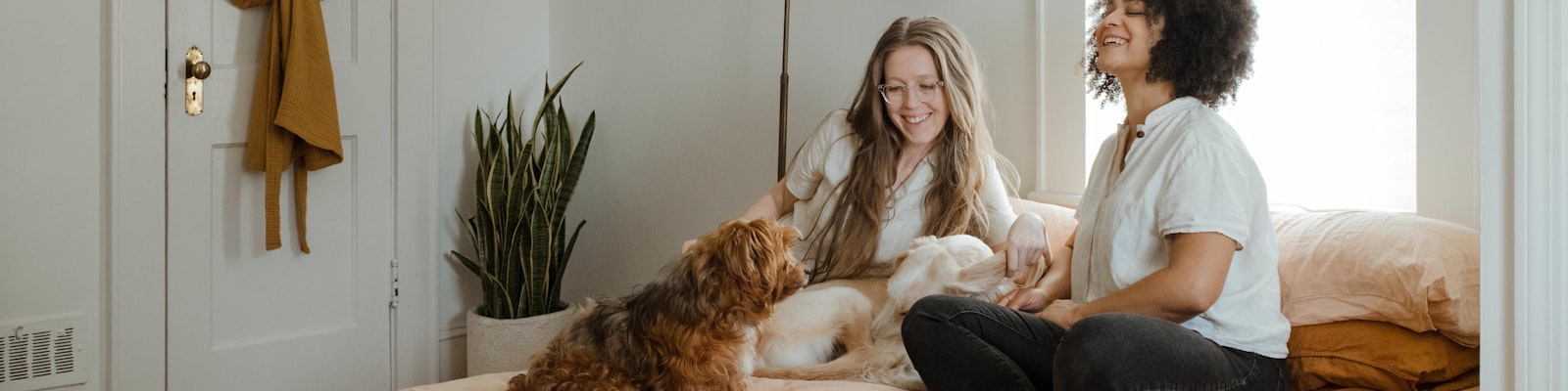 Happy family with their adopted dogs at home